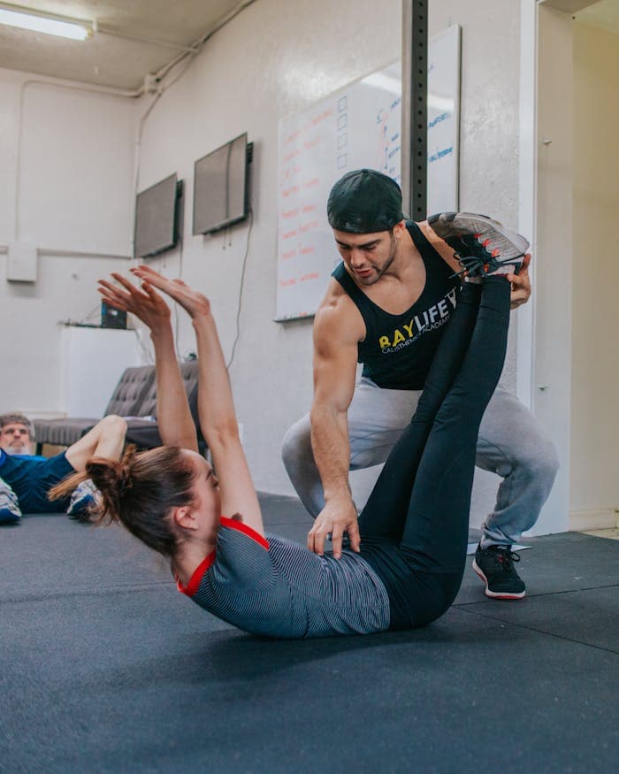 Real coach working with an athlete during a training session.