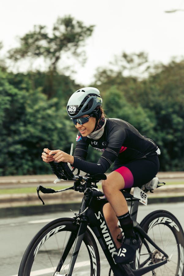 Cyclist racing on a road bike.